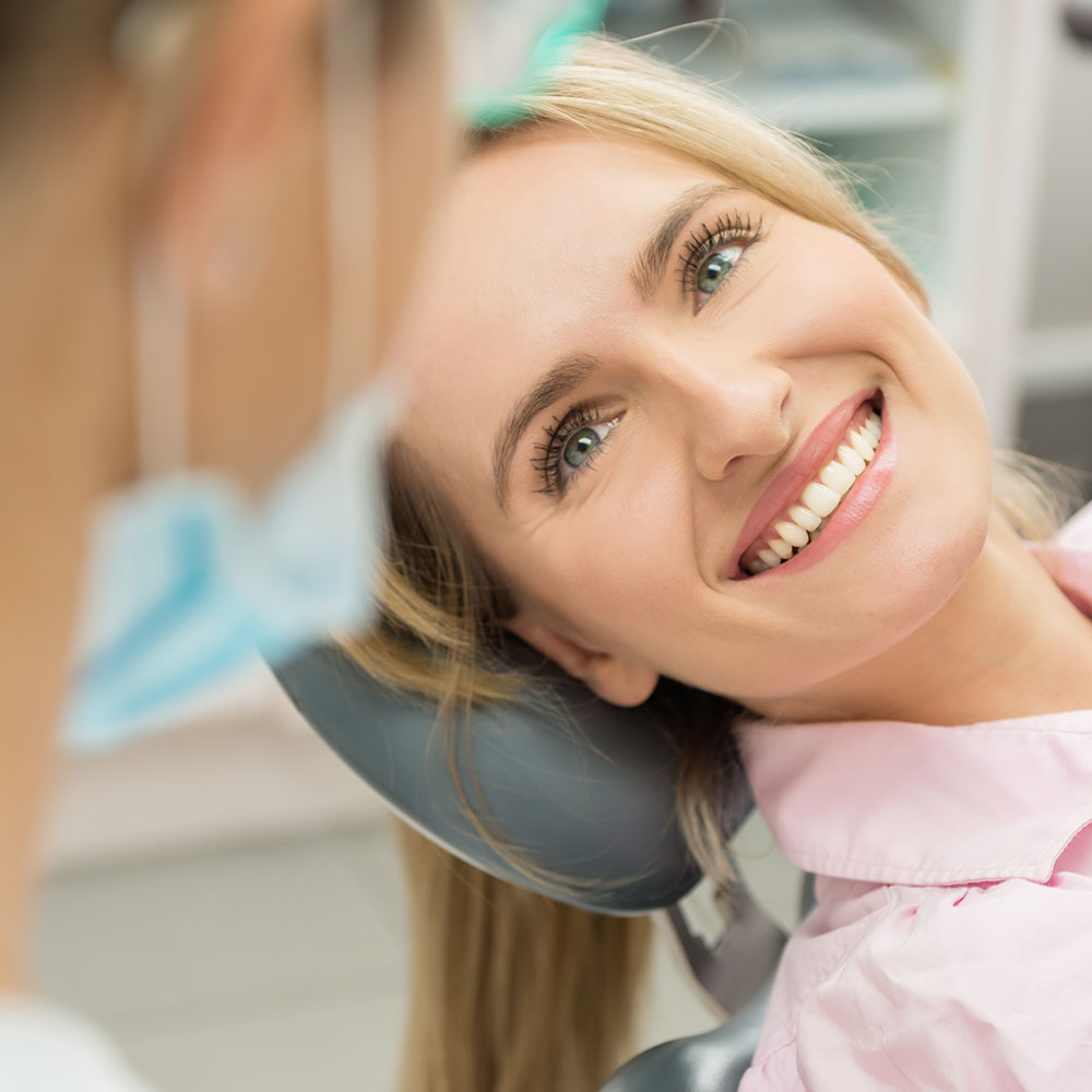 Patient smiling after root canal treatment in Downey