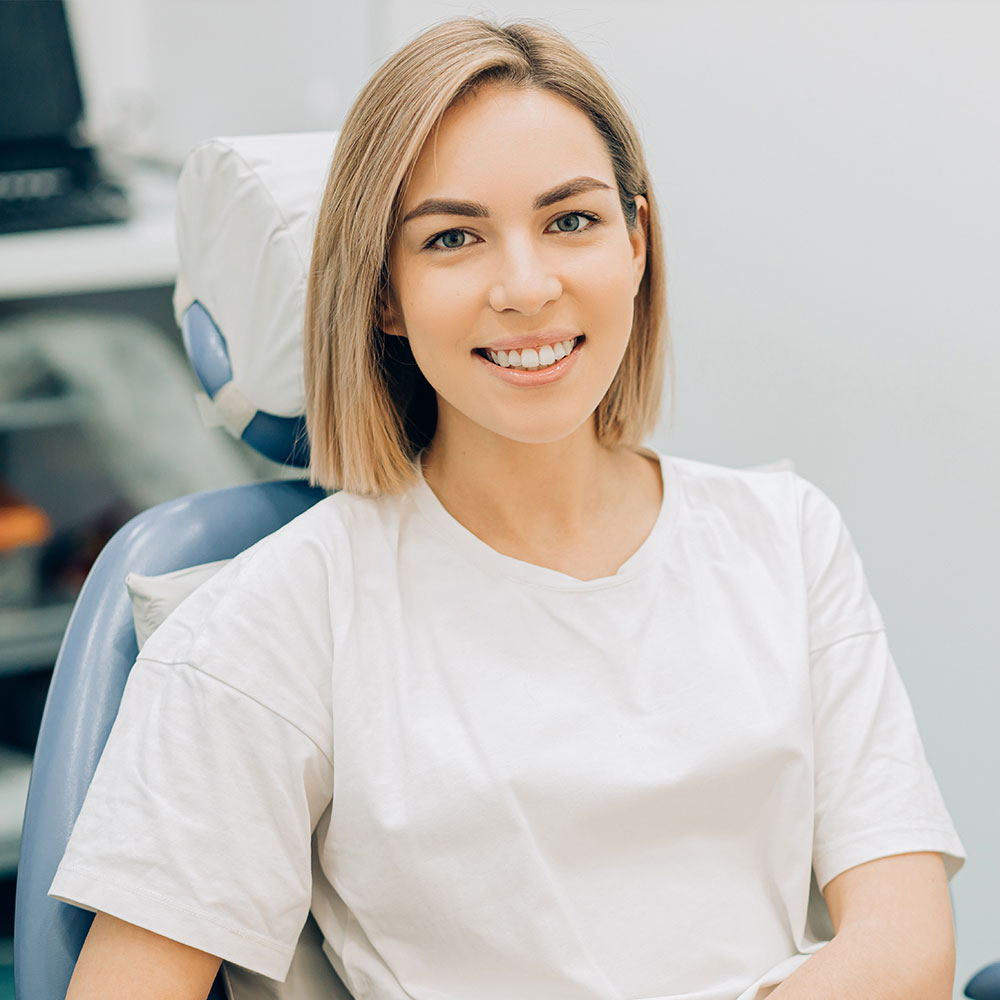 Dental patient after tooth pain treatment in Downey